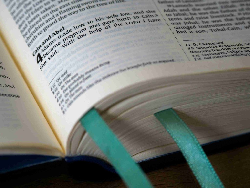 close-up-photo-of-book-page-with-green-book-mark