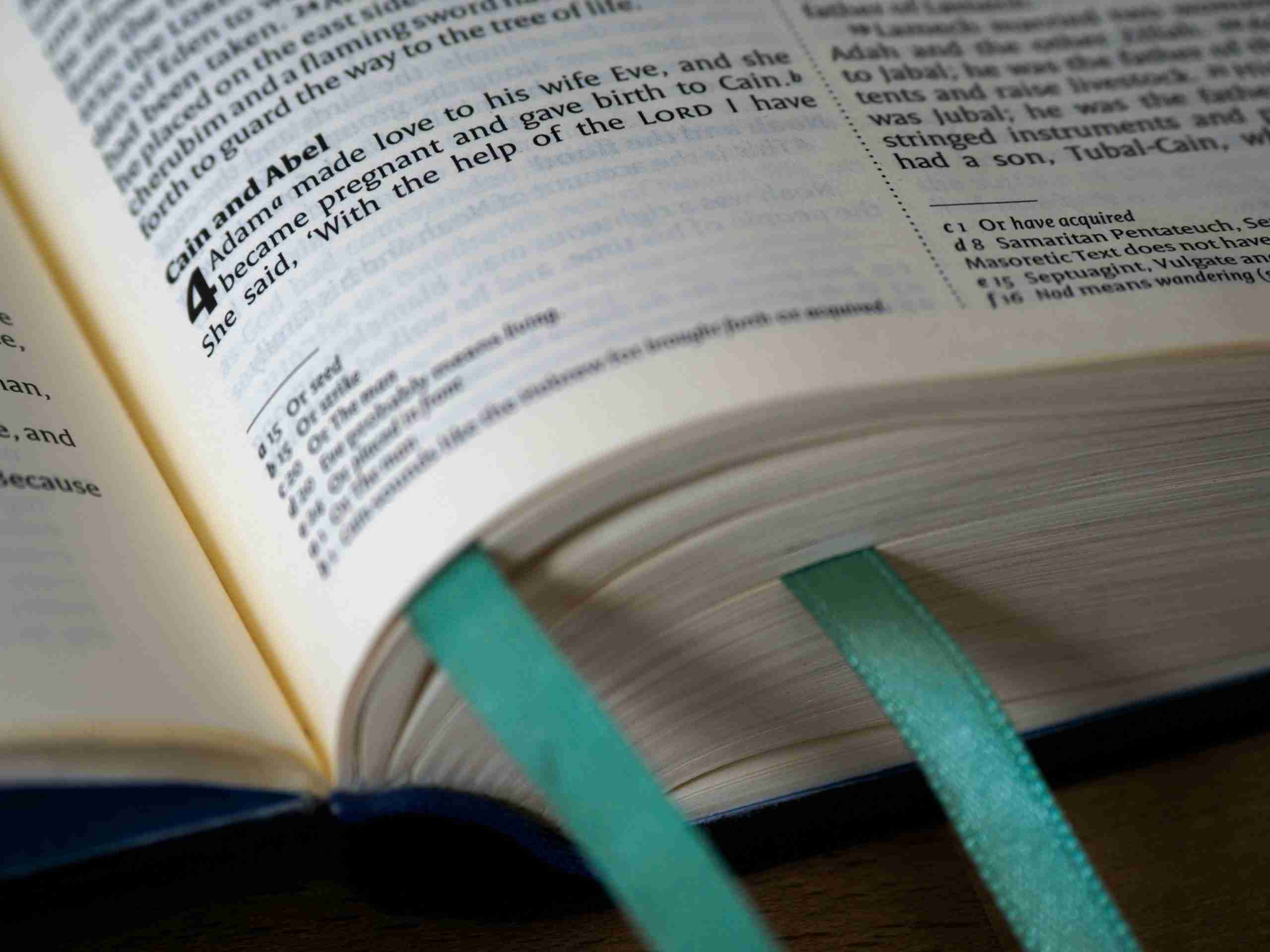 close-up-photo-of-book-page-with-green-book-mark