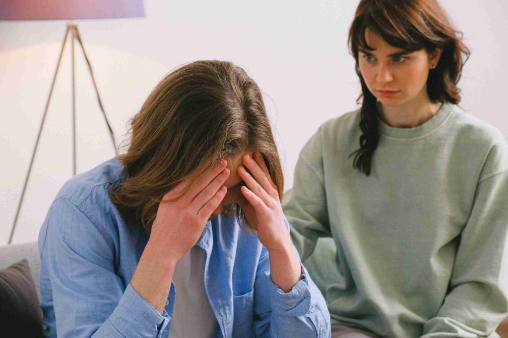 disappointed-woman-looking-at-sorrowful-man
