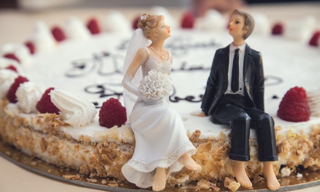 bride and groom on wedding cake